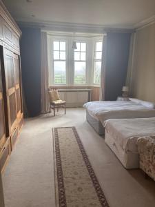 Postel nebo postele na pokoji v ubytování Ballynona House
