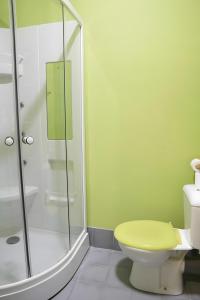 a bathroom with a toilet and a glass shower at La Platería I in Mambrilla de Castrejón