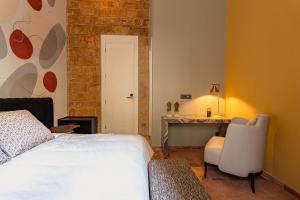 Postel nebo postele na pokoji v ubytování Canvas Boutique Hotel