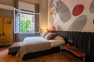 Postel nebo postele na pokoji v ubytování Canvas Boutique Hotel + 37 fotografií