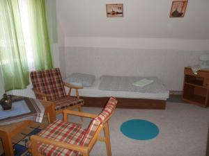 Tempat tidur dalam kamar di Pension Mikulka