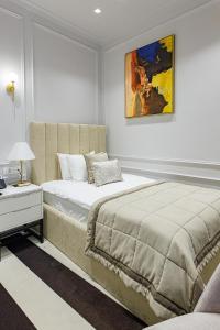 Postel nebo postele na pokoji v ubytování Hotel Balkan