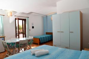 Кровать или кровати в номере Agriturismo Ezzi Mannu