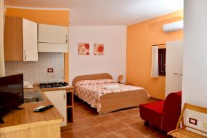 Кровать или кровати в номере Agriturismo Ezzi Mannu