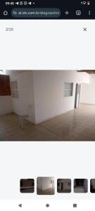 a picture of a room with a chair in it at Casa para alugar temporária in Maceió