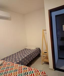 Ένα ή περισσότερα κρεβάτια σε δωμάτιο στο Refugio Aldeia dos Camarás