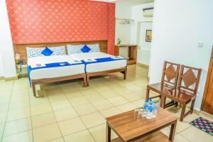 Postel nebo postele na pokoji v ubytování VKG Hotels