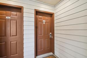 two doors in a hallway of a house at 6380 B6-1364 Byte-Sized Studio in Boston Commons in Greenwood Village