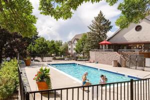 a family playing in the pool at a house at 6380 B6-1364 Byte-Sized Studio in Boston Commons in Greenwood Village +17 photos