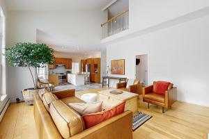 a living room with a couch and a table at Blissful Wakes in South Burlington