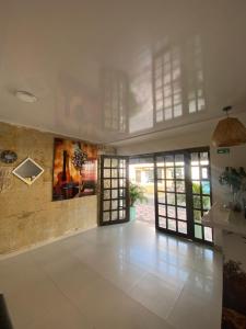 a room with a hallway with a violin on the wall at NaPoles valledupar Hotel in Valledupar