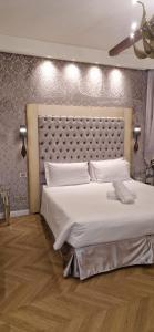 A bed or beds in a room at Cà Dell'Arte Palace