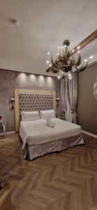 A bed or beds in a room at Cà Dell'Arte Palace