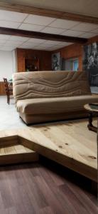 a bed with two pillows on top of it at Maison chez l'habitant in Bouère