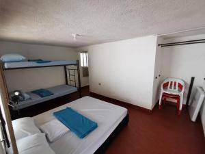 Ένα ή περισσότερα κρεβάτια σε δωμάτιο στο Villa Carmelita +11 φωτογραφίες