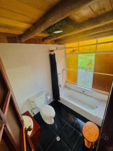 an overhead view of a bathroom with a toilet and a tub at Nodriza House in Baeza +23 photos