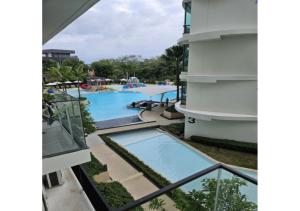 a view of the pool from the balcony of a hotel at HomeAwayFromHome in Phuket +3 photos