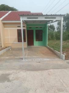 a small house with a green at Homestay syariah off in Karawang