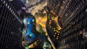 an aerial view of a building in a city at night at Awesome Value, Great Location in Manila