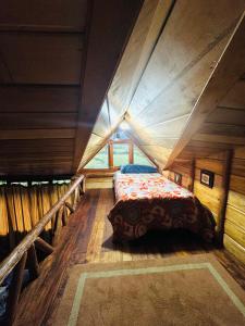 a bedroom with a bed in a attic at Nodriza House in Baeza +23 photos