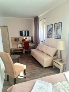 a living room with a couch and a table at B & B Tomula in Gdańsk
