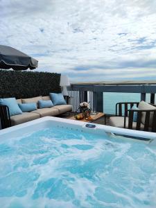 a large swimming pool sitting on top of a balcony at Royal Antibes - Luxury Hotel, Résidence, Beach & Spa in Antibes