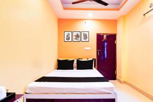 Ένα ή περισσότερα κρεβάτια σε δωμάτιο στο Hotel O CITY PLACE +27 φωτογραφίες