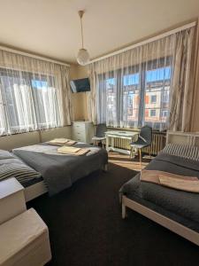 Postel nebo postele na pokoji v ubytování Hotel Alfa