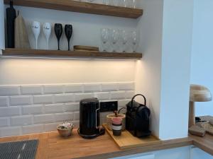 a counter with a coffee maker on a shelf at SEA VIEW Juweeltje in Knokke-Heist
