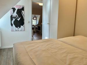 Postel nebo postele na pokoji v ubytování Hus op de Dün SPO ⇒ Erholung in historischem Flair Wattläufer