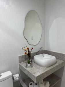 Um banheiro em Hospedaria Aconchego