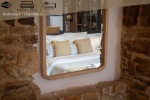Postel nebo postele na pokoji v ubytování Loft and Suites