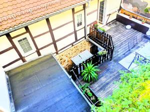 an overhead view of a wooden deck with a bench on a house at Urlaubsresidenz Schlossblick in Colditz