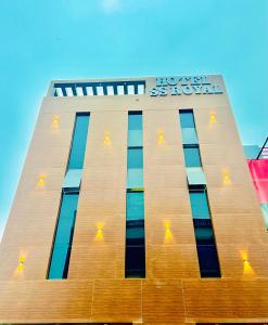 a building with a sign on the side of it at SS Royal International in Lucknow