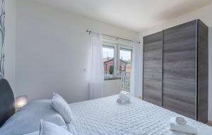 Ένα ή περισσότερα κρεβάτια σε δωμάτιο στο Appartement In Funtana Mit Grill +11 φωτογραφίες
