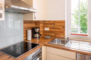 Kuchyň nebo kuchyňský kout v ubytování Entspannter Urlaub Am Meer Im Reethaus Simba