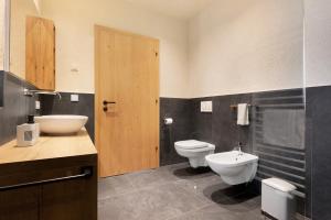 Kúpeľňa v ubytovaní Ratscheinerhof App Gipfelglück + 27 fotografií