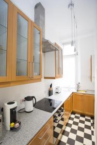 Kuchyň nebo kuchyňský kout v ubytování Waves + 23 fotografií