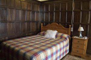 a bedroom with a bed and a lamp on a night stand at Balcon del Alba VUT N1238 in Lastres +45 photos
