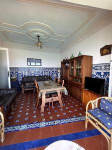 a living room with a table and a couch at Balcon del Alba VUT N1238 in Lastres