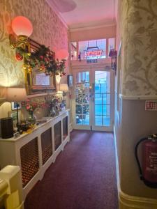 a room with a hallway with a door to a building at Westholme Hotel in Blackpool