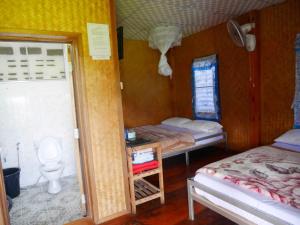 a small room with two beds and a toilet at Mae Klang Luang View in Ban Sop Mae Klang +37 photos
