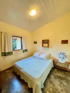 Postel nebo postele na pokoji v ubytování Casa com cachoeiras e contato com a natureza