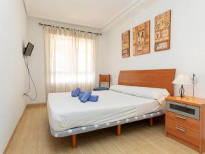 A bed or beds in a room at Apartment Vila De Oropesa IV by Interhome