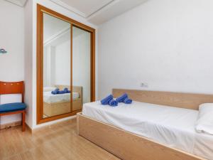 A bed or beds in a room at Apartment Vila De Oropesa IV by Interhome