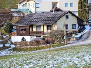 a house on a hill with snow at Holiday Home Zeitlos by Interhome in Reifnitz