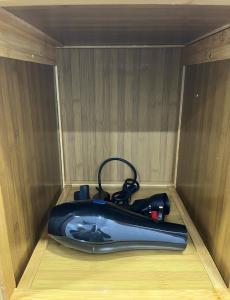 a small boat is sitting in a wooden box at AF Barokah Homestay Unit 1, Kuala Terengganu in Kuala Terengganu +14 photos