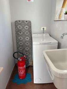 a bathroom with a washing machine and a sink at Molina apartment 213 in Pugnano +46 photos