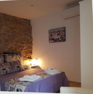 Postel nebo postele na pokoji v ubytování Casa Cueva El Arrabal