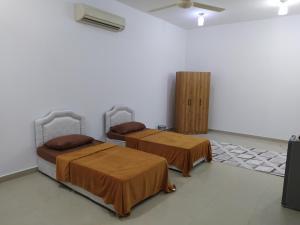 Giường trong phòng chung tại Gisa Hostel All Private Ensuite Rooms